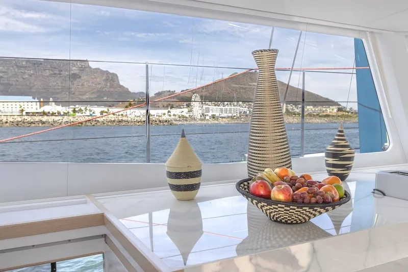  Yacht Photos Pics Luxurious Balance 580 yacht interior with fruit basket and scenic ocean view, 2027 model.