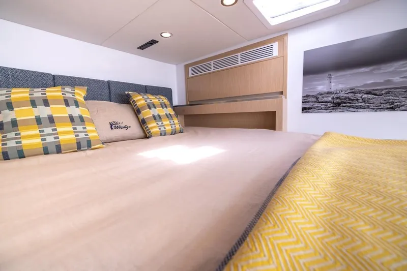 Yacht Photos Pics Luxurious bedroom interior of Balance 580 yacht, featuring cozy bedding and modern decor, 2027 model.