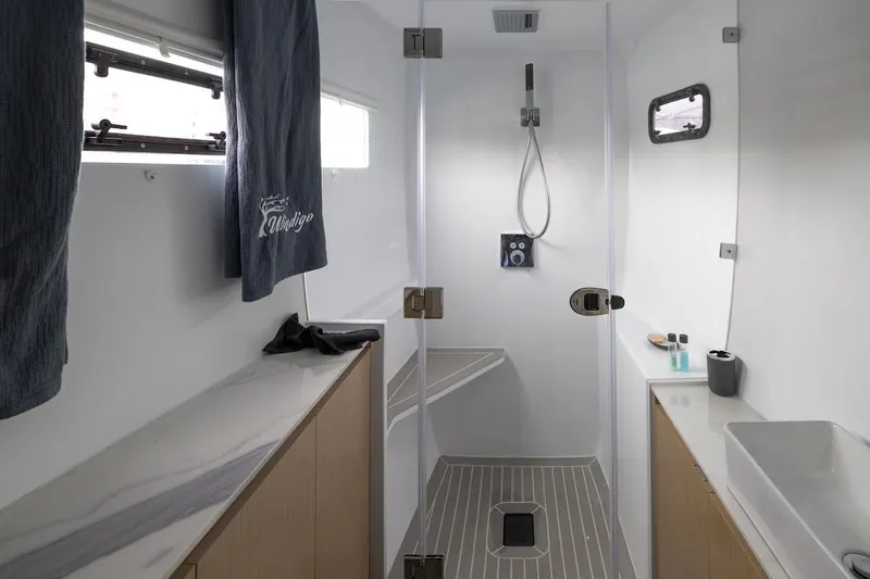  Yacht Photos Pics Modern bathroom in 2027 Balance 580 yacht with sleek shower and minimalist design.