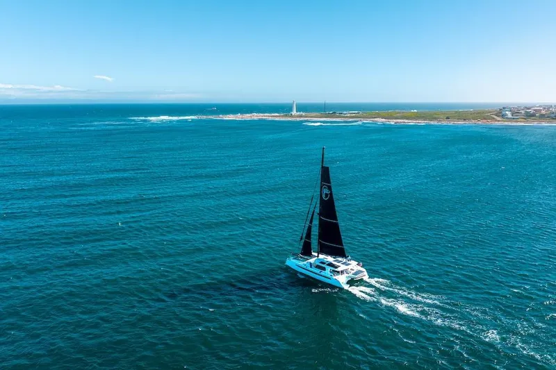  Yacht Photos Pics Sailing catamaran Balance 580 (2027) cruising in open ocean near coastline.