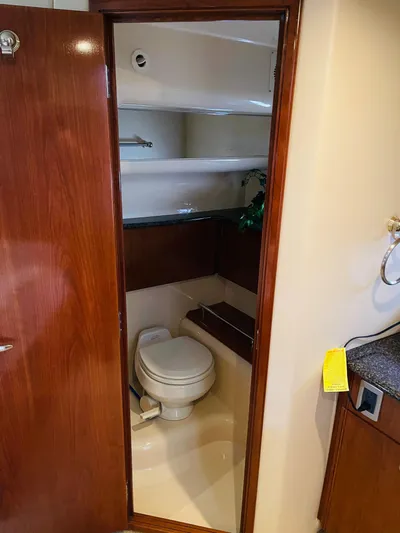  Yacht Photos Pics Bathroom in 2006 Meridian 408 Motoryacht with toilet and shelves.