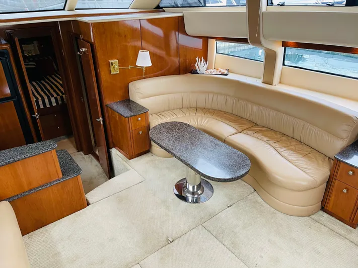  Yacht Photos Pics Interior of 2006 Meridian 408 Motoryacht with leather sofa and table.