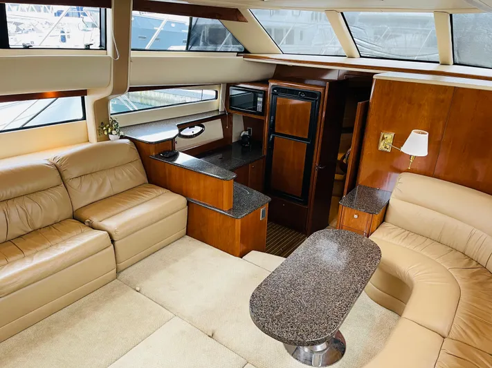  Yacht Photos Pics Interior of a 2006 Meridian 408 Motoryacht with leather sofas and wood furnishings.