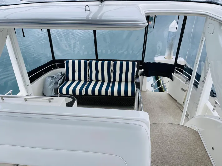  Yacht Photos Pics Interior of a 2006 Meridian 408 Motoryacht with striped sofa.