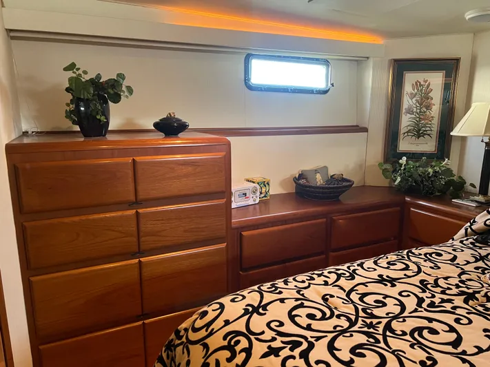  Yacht Photos Pics Luxurious 1995 Viking Sports Yacht interior with elegant wood cabinetry and decorative accents.
