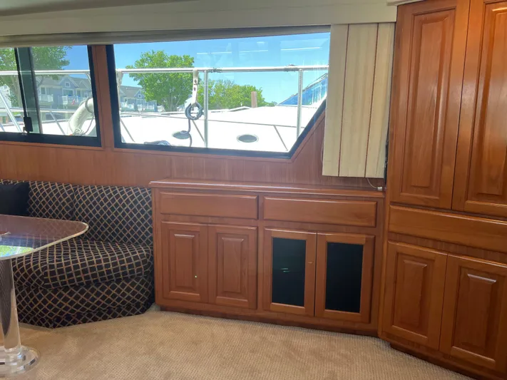  Yacht Photos Pics Interior of a 1995 Viking Sports Yacht with wood cabinetry and patterned seating.