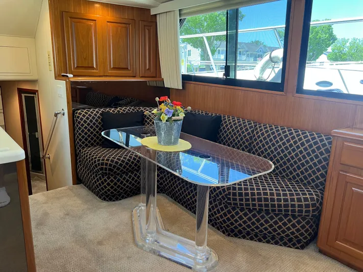  Yacht Photos Pics Interior of 1995 Viking Sports Yacht with elegant seating and glass table.