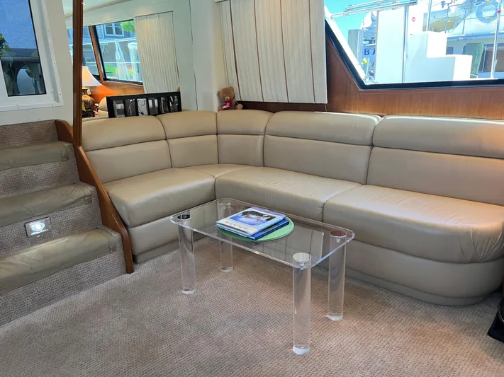  Yacht Photos Pics Luxurious interior of a 1995 Viking Sports Yacht with beige leather seating and glass table.