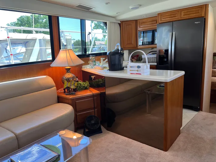  Yacht Photos Pics Interior of a 1995 Viking Sports Yacht with modern kitchen and cozy seating area.