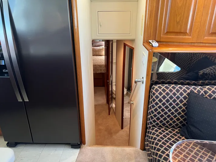  Yacht Photos Pics Interior of a 1995 Viking Sports Yacht with stairs leading to a bedroom.