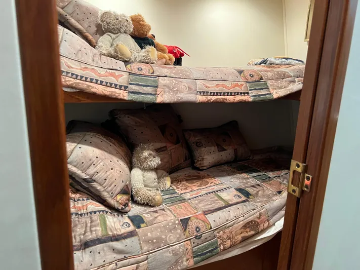  Yacht Photos Pics Bunk beds with patterned bedding and teddy bears on a 1995 Viking Sports Yacht.