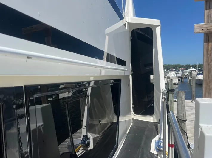  Yacht Photos Pics 1995 Viking Sports Yacht docked at marina, showcasing sleek design and modern features.