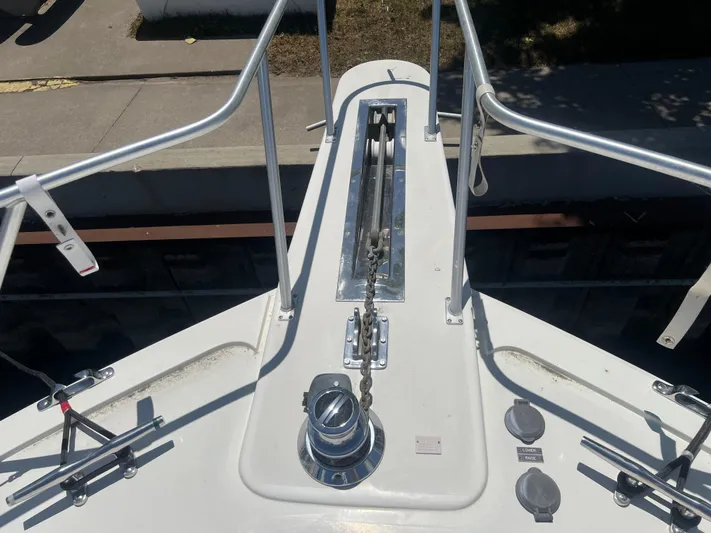  Yacht Photos Pics Bow of a 1995 Viking Sports Yacht with anchor chain and railing.