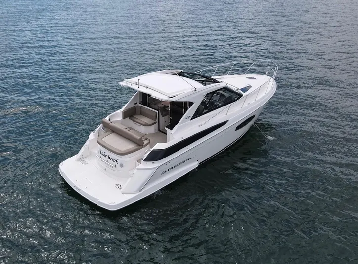 Lake Break Yacht Photos Pics 2016 Regal 42 Sport Coupe yacht cruising on open water.