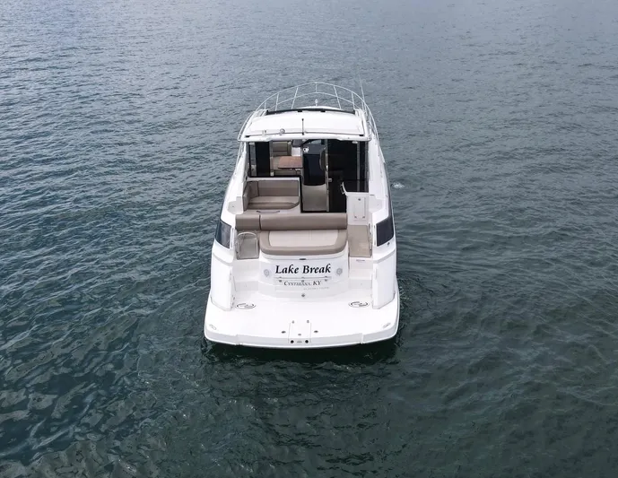 Lake Break Yacht Photos Pics 2016 Regal 42 Sport Coupe on water, rear view, named "Lake Break".