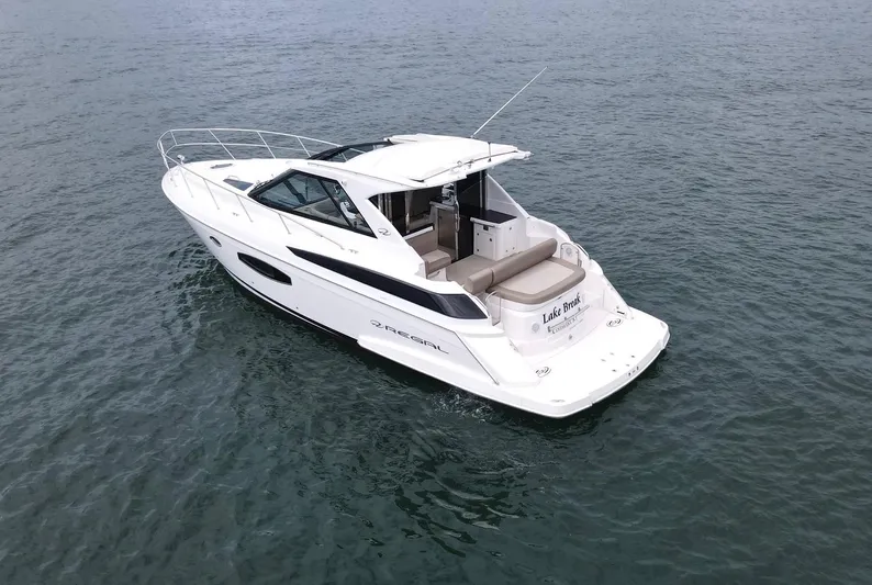 Lake Break Yacht Photos Pics 2016 Regal 42 Sport Coupe yacht cruising on open water.