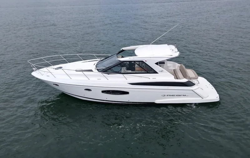 Lake Break Yacht Photos Pics 2016 Regal 42 Sport Coupe yacht cruising on open water.