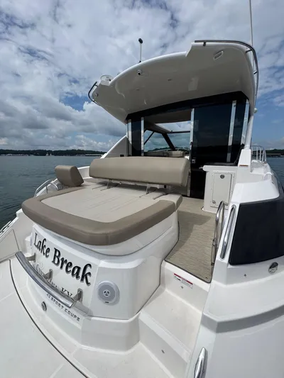 Lake Break Yacht Photos Pics 2016 Regal 42 Sport Coupe yacht with spacious deck and seating, named "Lake Break."