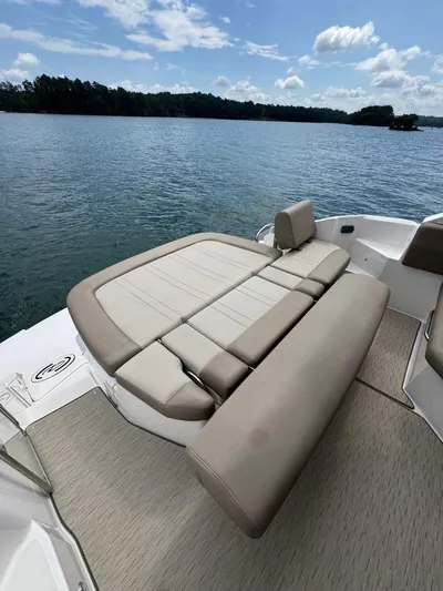 Lake Break Yacht Photos Pics 2016 Regal 42 Sport Coupe boat with spacious sunbed on a serene lake.