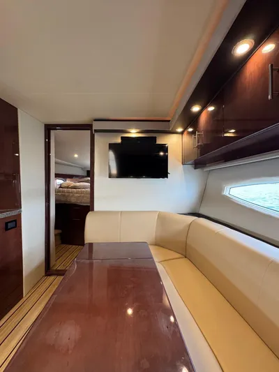 Lake Break Yacht Photos Pics Interior of 2016 Regal 42 Sport Coupe with elegant seating and mounted TV.