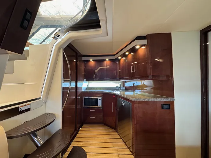 Lake Break Yacht Photos Pics Luxurious kitchen interior of 2016 Regal 42 Sport Coupe yacht with modern amenities.