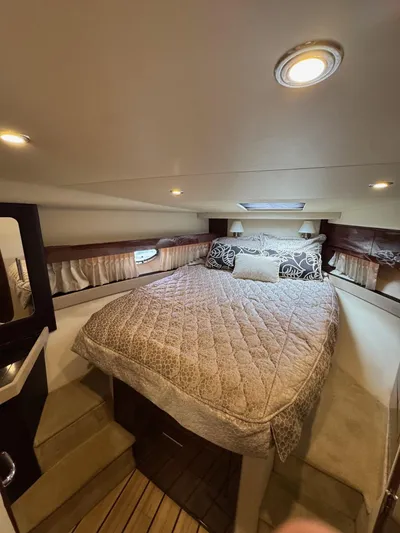 Lake Break Yacht Photos Pics Luxurious cabin interior of 2016 Regal 42 Sport Coupe with cozy bedding.