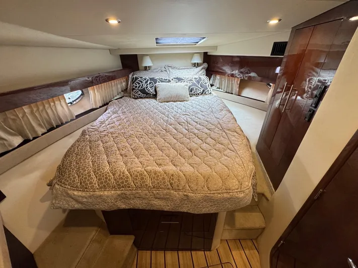 Lake Break Yacht Photos Pics Luxurious bedroom interior of 2016 Regal 42 Sport Coupe yacht with elegant bedding.