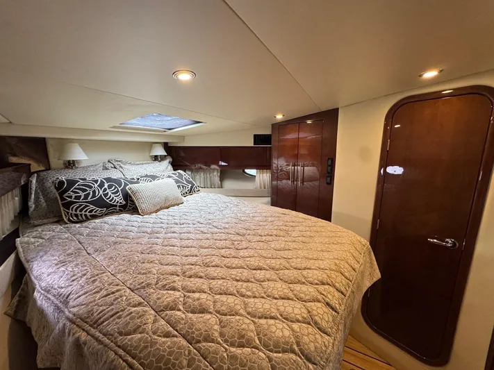 Lake Break Yacht Photos Pics Luxurious bedroom interior of 2016 Regal 42 Sport Coupe yacht with elegant bedding.