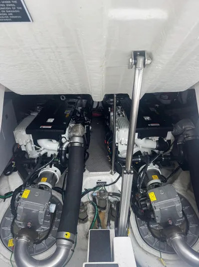 Lake Break Yacht Photos Pics Engine room of a 2016 Regal 42 Sport Coupe with dual engines and mechanical components.