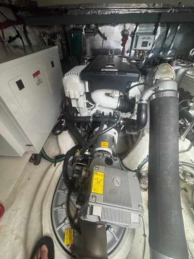 Lake Break Yacht Photos Pics Engine room of a 2016 Regal 42 Sport Coupe, showcasing mechanical components and wiring.