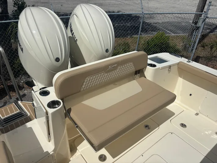  Yacht Photos Pics 2025 Scout 277 LXF boat with dual Yamaha engines and beige seating.