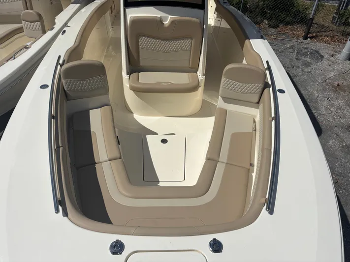  Yacht Photos Pics 2025 Scout 277 LXF boat interior with beige seating and sleek design.