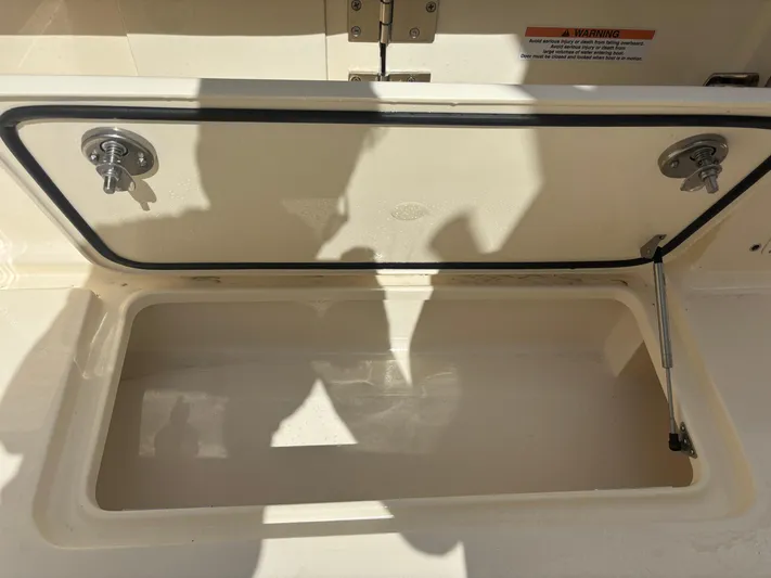  Yacht Photos Pics Open storage compartment on 2025 Scout 277 LXF boat.