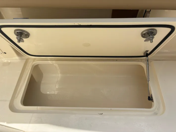  Yacht Photos Pics Open storage compartment on 2025 Scout 277 LXF boat.