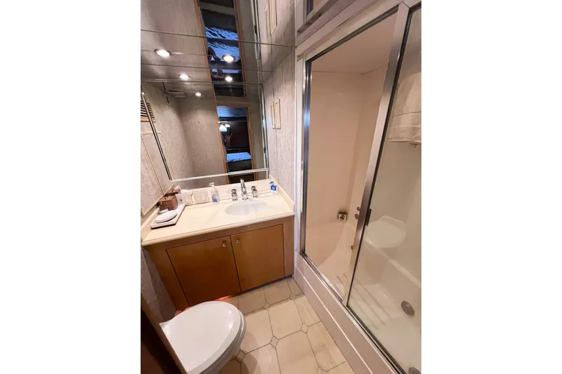 Kristin Lee Yacht Photos Pics Bathroom interior of 2001 Hatteras 75 Cockpit Motor Yacht with shower and vanity.