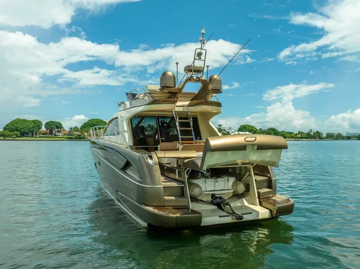 Gabriela Yacht Photos Pics Luxury 2012 Riva Sport 56 yacht on serene water under blue sky.