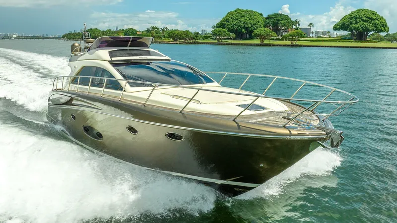 Gabriela Yacht Photos Pics Luxurious 2012 Riva Sport 56 yacht cruising on a scenic waterway.