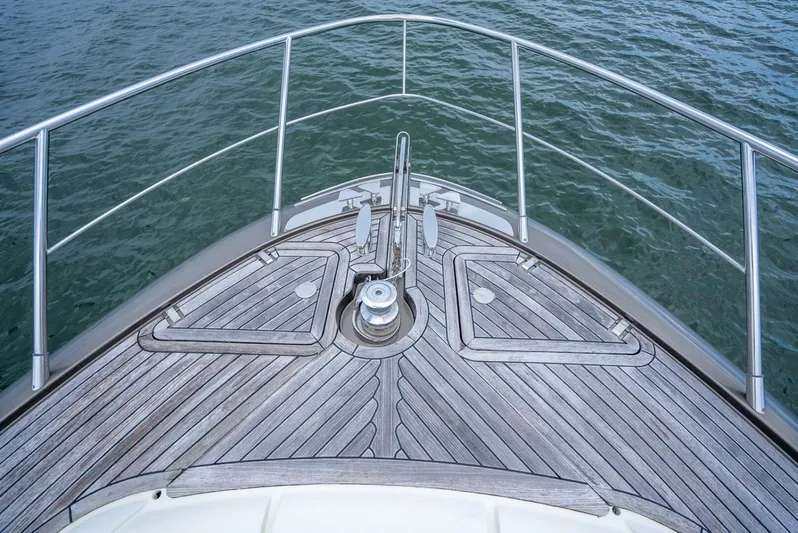 Gabriela Yacht Photos Pics Bow of 2012 Riva Sport 56 yacht with wooden deck and metal railings.