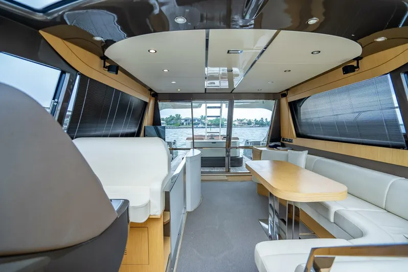 Gabriela Yacht Photos Pics Luxurious interior of a 2012 Riva Sport 56 yacht with modern seating and panoramic windows.