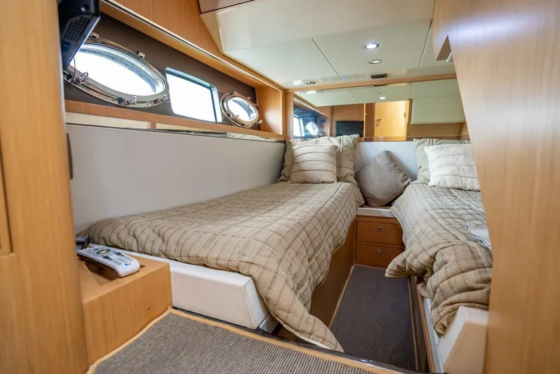 Gabriela Yacht Photos Pics Luxurious cabin interior of 2012 Riva Sport 56 yacht with twin beds and elegant decor.