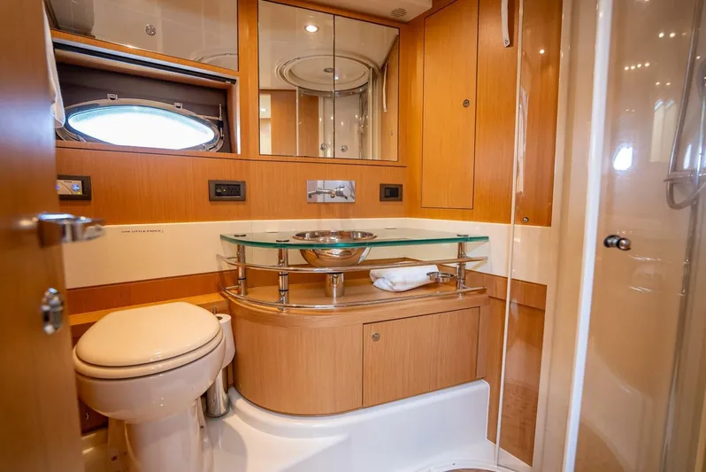 Gabriela Yacht Photos Pics Luxurious bathroom interior of 2012 Riva Sport 56 yacht with modern fixtures and wood finish.