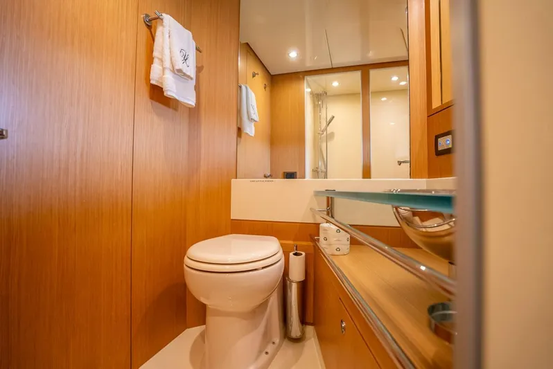 Gabriela Yacht Photos Pics Luxurious bathroom interior of 2012 Riva Sport 56 yacht with modern fixtures and wooden accents.