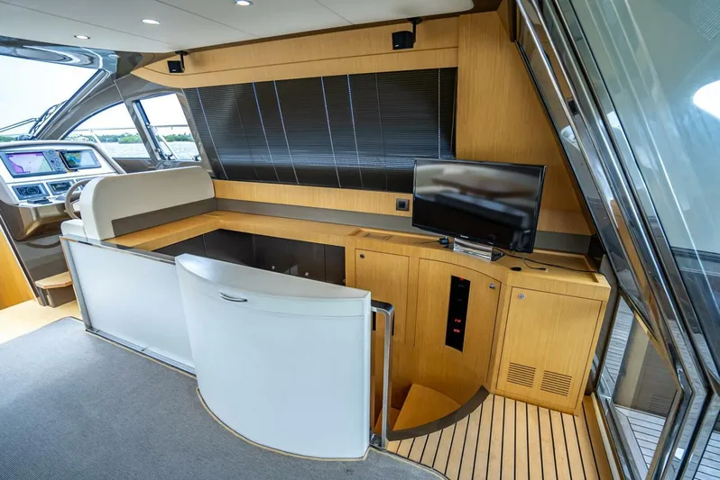 Gabriela Yacht Photos Pics Luxurious interior of 2012 Riva Sport 56 yacht with modern helm and entertainment area.