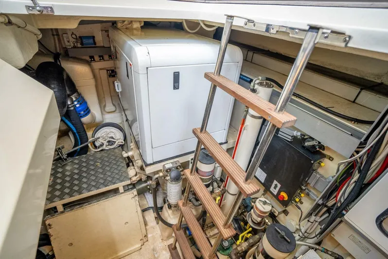 Gabriela Yacht Photos Pics Engine room of 2012 Riva Sport 56 yacht with equipment and ladder.