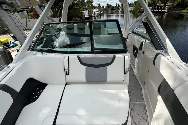  Yacht Photos Pics 2022 Chaparral 280 OSX boat interior with white seating and sleek design.