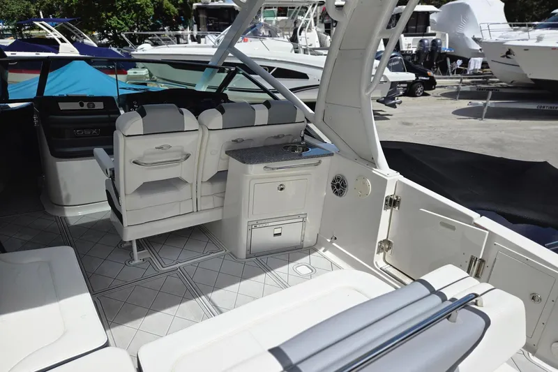  Yacht Photos Pics 2022 Chaparral 280 OSX boat interior with seating and kitchenette area.