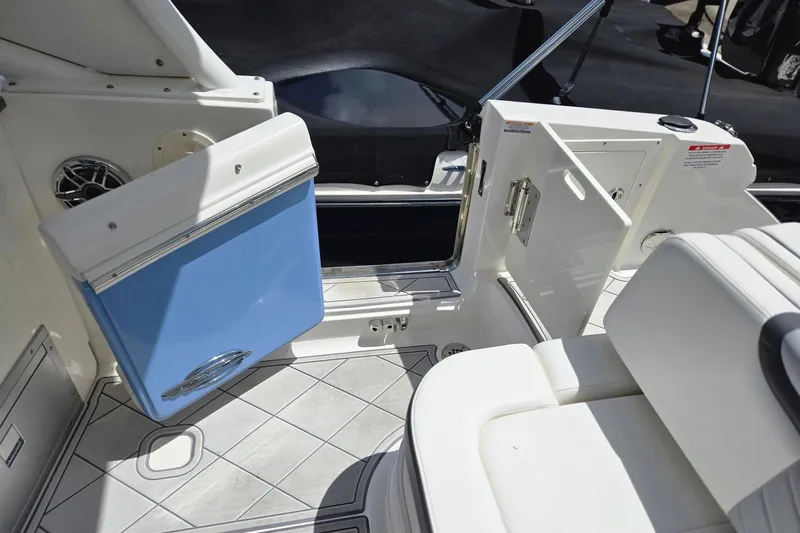  Yacht Photos Pics 2022 Chaparral 280 OSX boat interior with open storage compartments and seating.