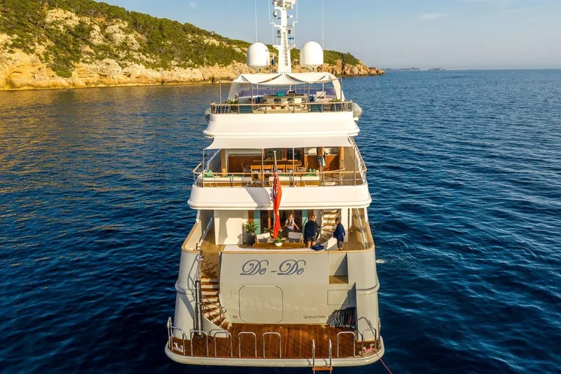  Yacht Photos Pics Luxurious 2002 CMN Custom yacht "De-De" cruising in serene blue waters.