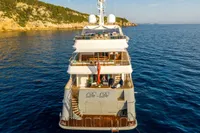 Luxurious 2002 CMN Custom yacht "De-De" cruising in serene blue waters.