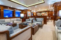 Luxurious yacht interior with elegant seating, wooden accents, and modern decor, CMN Custom 2002.